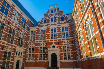 Obraz premium Dutch East India Company VOC House (Oostindisch Huis), now belongs to University of Amsterdam at Kloveniersburgwal canal in central Amsterdam, Netherlands. Canal Ring Area of Amsterdam is designed as 