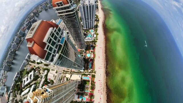 Top aerial stock video Miami Beach highrise coastal buildings
