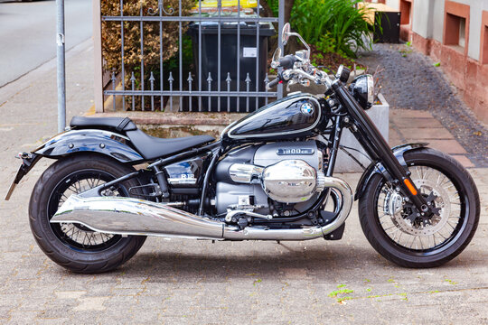 Amsterdam, Netherlands - 22.01.2026: Classic black bmw r18 first edition motorcycle parked on a city sidewalk with chrome exhaust and boxer engine