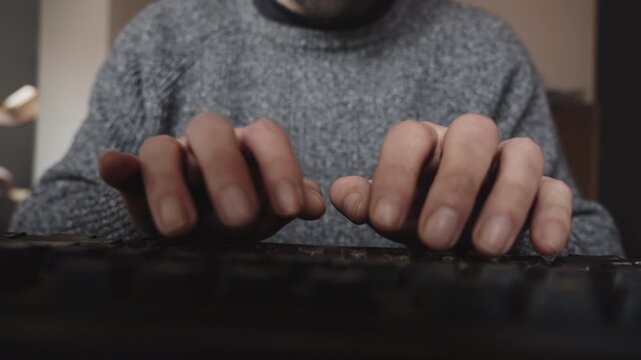Front-view close-up of hands typing rapidly on a computer keyboard, conveying productivity, deadlines, concentration, and modern digital work culture.