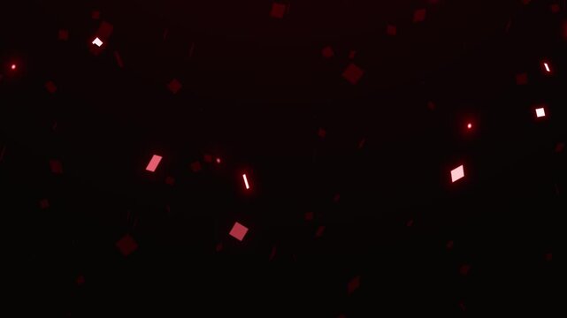 Confetti pieces drift slowly through a dark space to represent a celebratory or party atmosphere.