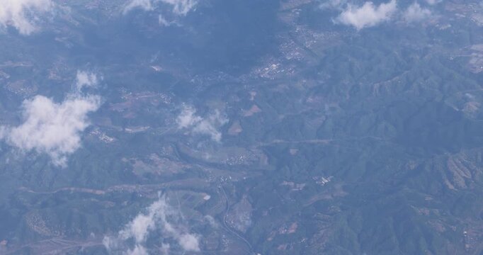 JAPAN. Aerial view flying above landscape and mountains May 1 2026