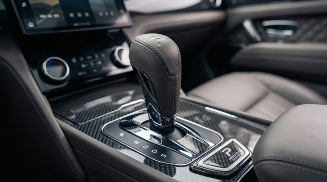 Closeup of a cars gearshift and center console interior