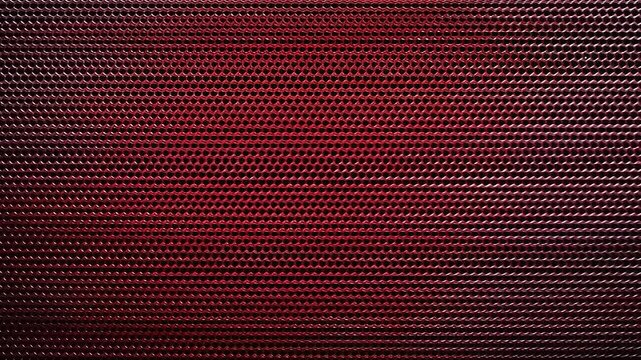 A close-up of a textured surface, transitioning from purple to red. Tiny cells form rows