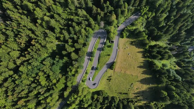 Winding mountain snake road Valle Spluga Lombardy Italy scenic road trip destination, aerial view