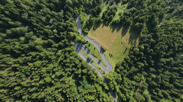 Aerial view of a winding mountain snake road Valle Spluga Italy alpine valley drone view