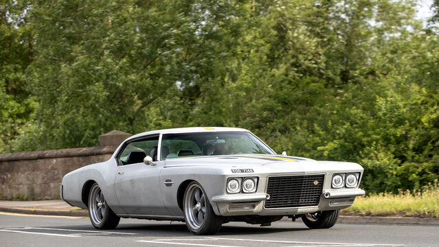 Stony Stratford,Bucks,UK - June 7th 2026:  1972 Buick Riviera classic American car driving on a British road