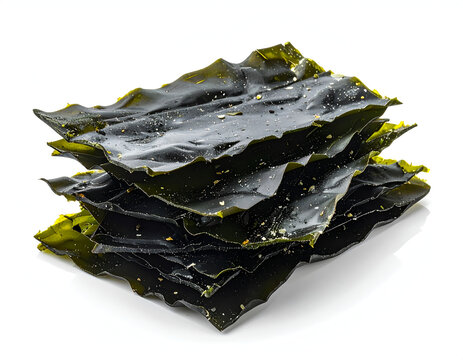 Pristine minimalist culinary photography capturing a neatly stacked pile of dry dark green kombu seaweed.