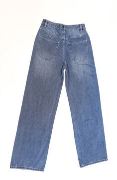 Blue straight leg baggy women's jeans on white background