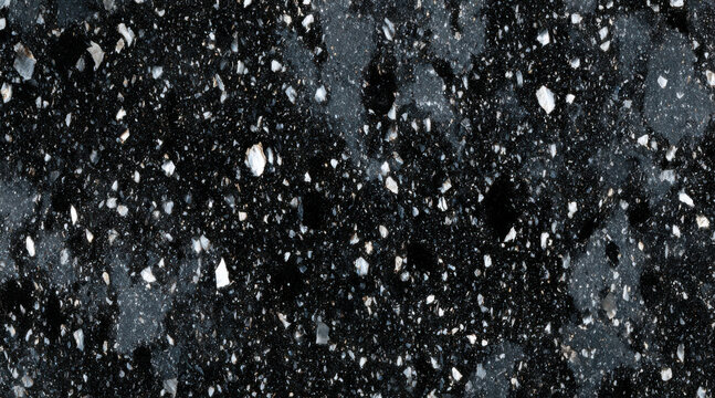 Dark speckled volcanic stone surface texture