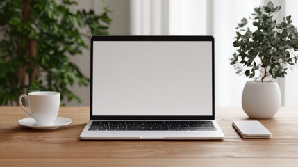 Fototapeta premium Minimalist Office Workspace with Laptop, Plants, and Coffee Mug on Wooden Table