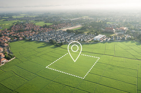 Aerial drone view of green land in San Sai District, Chiang Mai, Thailand featuring surveyed land parcel with GPS location marker and boundary overlay. Real estate concept highlighting land for sale.