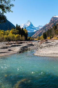 The confluence of mountain rivers against the backdrop of Mount Belalakaya