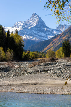 View of river and Mount Belalakaya in North Caucasus mountains at autumn