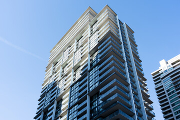 Fototapeta premium Modern high rise residential buildings with glass balconies