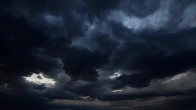 Dark storm clouds gathering in the sky, creating a dramatic atmosphere. A sign of impending weather changes and nature's power