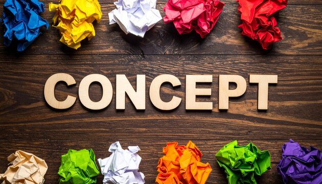 Concept word with colorful crumpled papers on wooden background