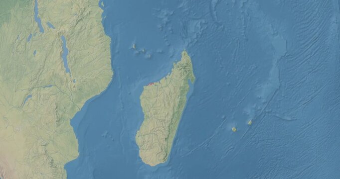 Madagascar on Globe. Zoom into the country with Earth spinning on dark background. Physical world map with Madagascar and label on it. Country view animation.