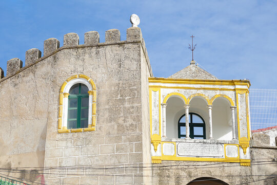 Arco de Santa Clara historic stone archway and medieval fortification walls under a blue sky in the garrison border town of Elvas, Alentejo region, Portugal.