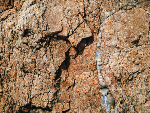 Natural light brown rock background. Stone texture. Grunge granite surface.