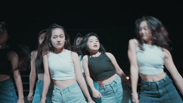 Dancers Performing Body Roll Move in Unison