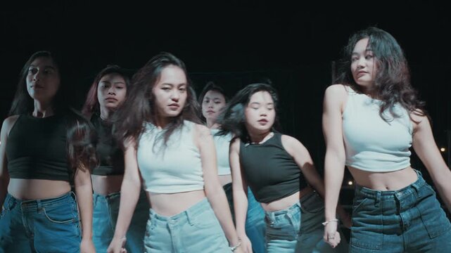 Energetic Hair Flip by Dance Group During Performance