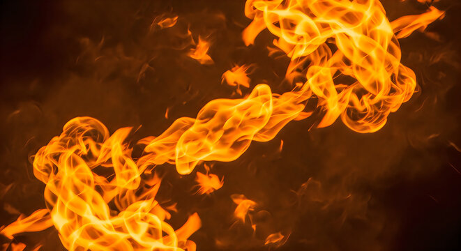 Closeup of bright orange and yellow flames against a dark background, capturing the dynamic movement and intense heat of a fire with swirling smoke and glowing embers