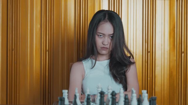 Unhappy Woman Crossing Arms During Chess Match