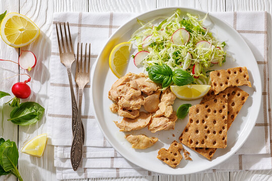 Cod liver with fresh salad, lemon, crispbreads