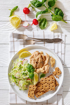 Cod liver with fresh salad, lemon, crispbreads