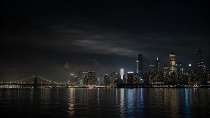 Obraz premium A dramatic nighttime cityscape featuring a bridge and illuminated skyscrapers reflected in dark water under a cloudy sky.