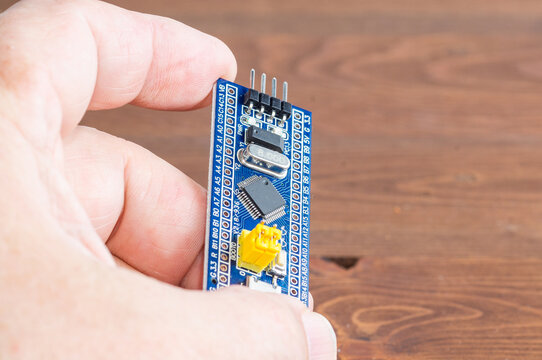 Development board STM and programmer in hand