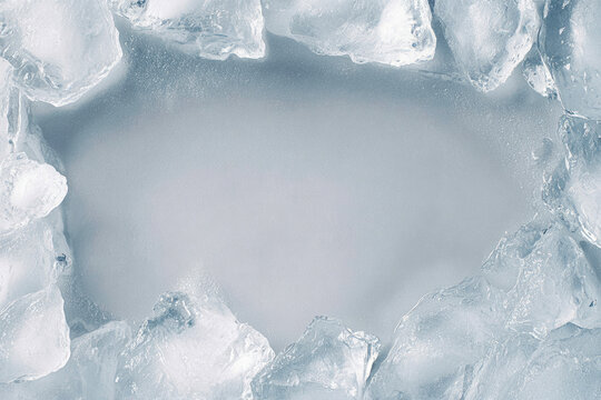 Cold Ice Cubes Frame with Frosty Texture and Copy Space, Abstract Frozen Blue Background for Refreshing Concepts and Product Display