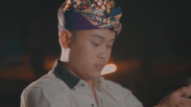 Hands Clasped in Prayer by Balinese Man