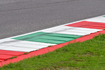 Obraz premium colored curb on a racing track