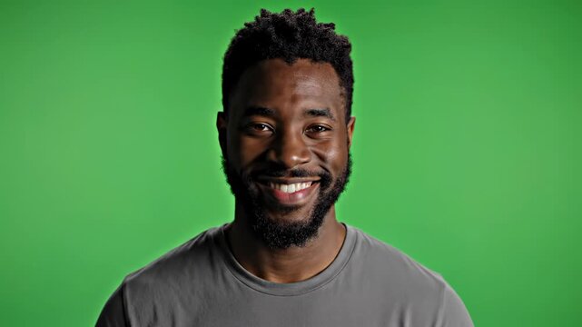 Man's expressions changing with subtle shifts in lighting against a green screen backdrop