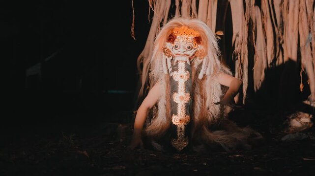 Menacing Rangda Crouching in Dark Shadows