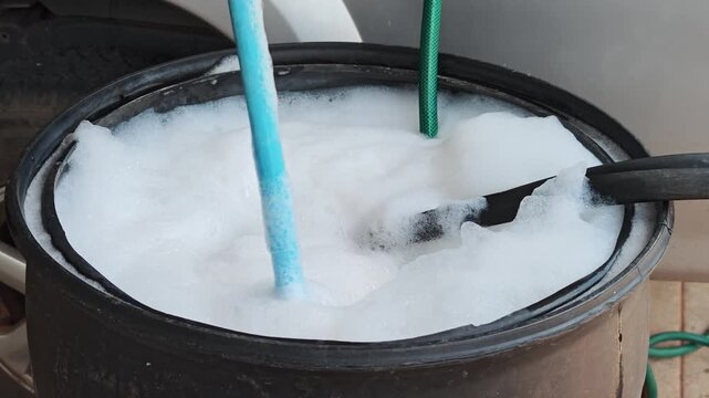 Mixing termite control solutions, diluting termite control solutions, termite control.