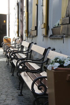 Traditional wooden benches and window shutters in historic street of Kufstein, Austria