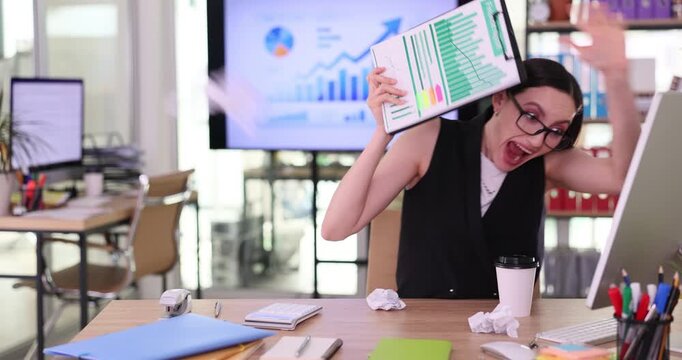 Frightened woman office worker in formal attire hides behind clipboard with important documents. Crumpled sheets of paper fly across modern office