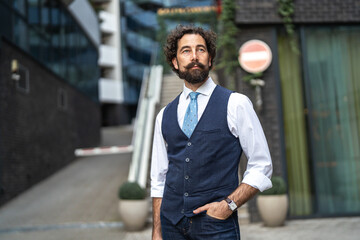 Fototapeta premium Stylish man with beard and mustache in urban setting