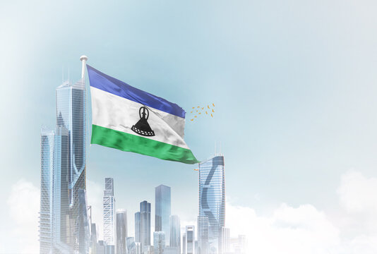 Lesotho flag waving with modern futuristic buildings. Lesotho national flag beautifully waving in the sky.