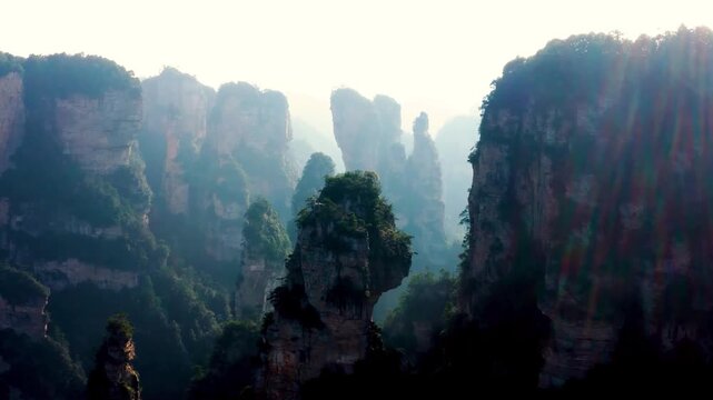 Sandstone mountain pillar in Wulingyuan China creates majestic landscape background for nature documentary and cinematic travel film projects