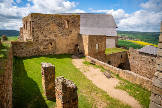 Interior courtyard and stone ruins of Tocnik Castle overlooking the Bohemian countryside. Medieval heritage and preservation concept