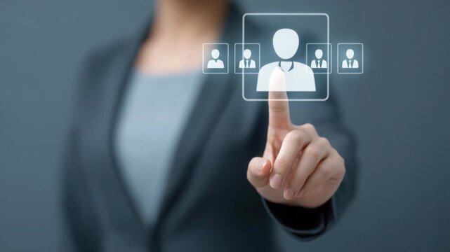 Business professional selecting digital virtual icon of user profile on transparent interface background for recruitment or human resource management concept