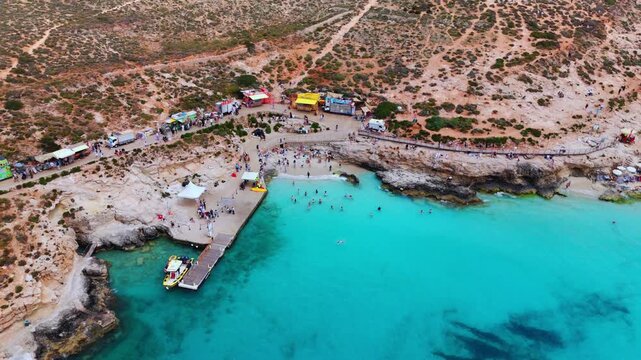 The Blue Lagoon is a highly popular, shallow strait between Comino and Cominotto in Malta, celebrated for its brilliant turquoise waters and sandy seafloor. It is a major destination for swimming,