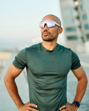 Portrait of a young man runner prepering for fitness exercise wearing vr glasses outdoors