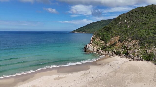 Drone fly toward secluded coastline with islands in Ninh Phuoc, Khanh Hoa, Vietnam