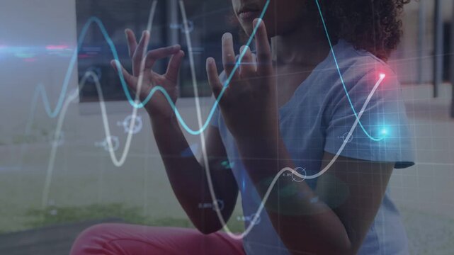 Girl folding palms forming mudra moving to knees meditating while waveform aligning with hands