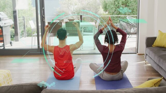 Male, nonbinary duo following pulsing teal AR guide, doing stretches on yoga mats for health